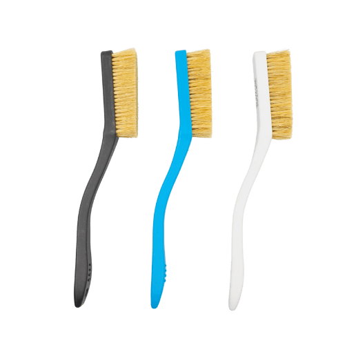 three plastic brushes with boar hair bristles used for rock climbing